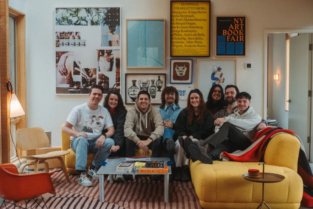 A family group sitting together on a couch in a warm living room